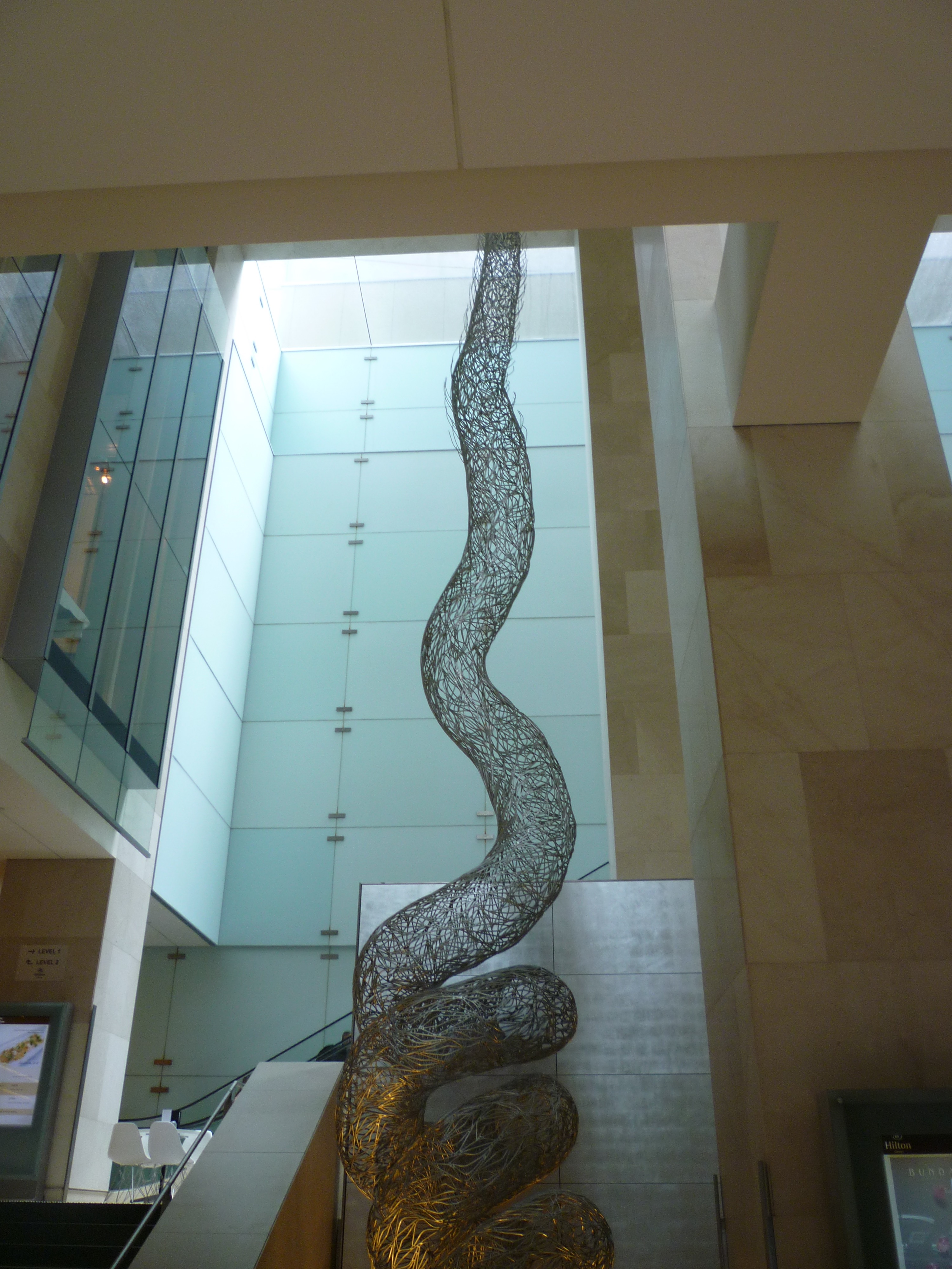 Bronwyn Oliver’s suspended Vine sculpture beside the stairs in Hilton Sydney’s lobby.
